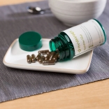 pharmanex-reishimax-glp-bottle-and-capsules-lifetystyle-image.jpg