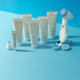 nu-skin-ageloc-lumispa-io-face-cleansing-and-eyecare-beauty-device-blue-background-lifestyle-image.jpg